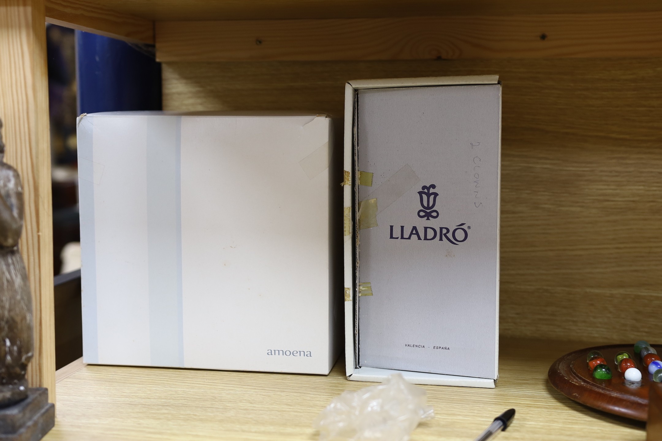 A boxed Lladro figure and another